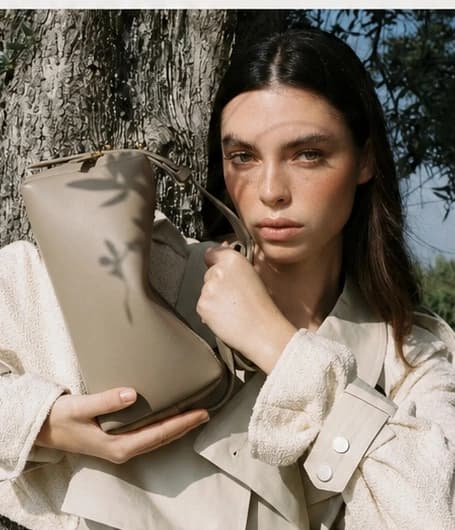 Taupe soft handbag showing the importance of material hand feel